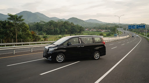 Toyota MPV van traveling smoothly on Trans-Java highway
